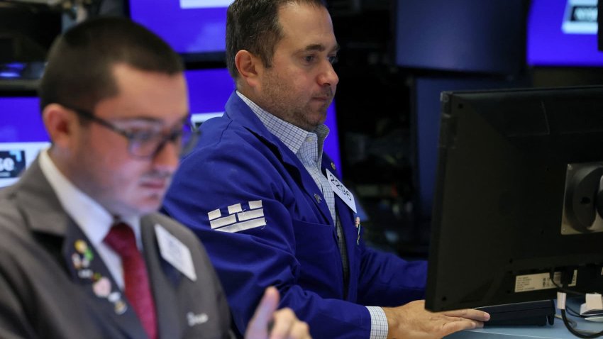 Traders work on the floor at the New York Stock Exchange (NYSE) in New York City, U.S., May 15, 2024.