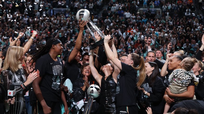The New York Liberty celebrate after wining the 2024 WNBA Championship against the Minnesota Lynx during Game 5 of the 2024 WNBA Finals on October 20, 2024 at Barclays Center in Brooklyn, New York. 