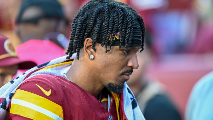 LANDOVER, MARYLAND – OCTOBER 20: Jayden Daniels #5 of the Washington Commanders walks off the field into the tunnel during the first quarter against the Carolina Panthers at Northwest Stadium on October 20, 2024 in Landover, Maryland. (Photo by Greg Fiume/Getty Images)